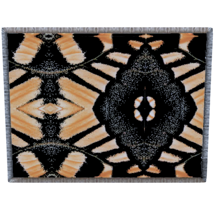 a pale pink and beige and black queen sized blanket